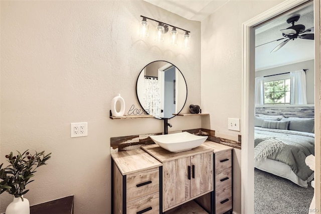 bathroom featuring ceiling fan and vanity