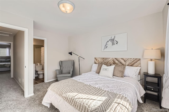 carpeted bedroom featuring ensuite bathroom