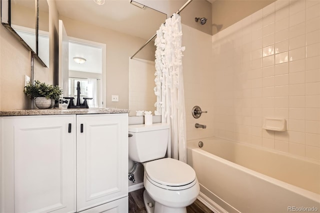 full bathroom with shower / tub combo with curtain, toilet, vanity, and hardwood / wood-style floors