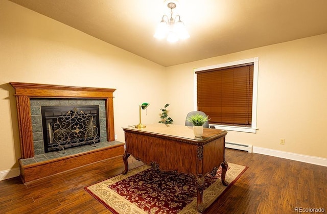 home office with a notable chandelier, dark hardwood / wood-style flooring, a fireplace, and a baseboard radiator