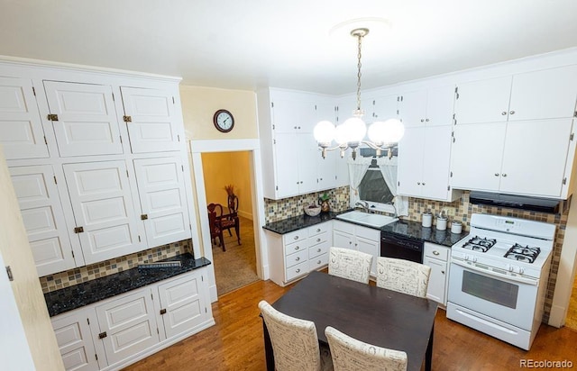 kitchen with white gas range, white cabinetry, dishwasher, dark hardwood / wood-style floors, and pendant lighting