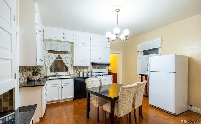 kitchen with backsplash, white appliances, sink, dark hardwood / wood-style floors, and white cabinetry