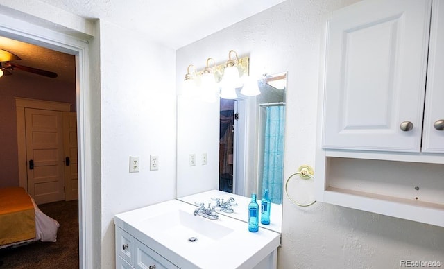 bathroom featuring ceiling fan and vanity