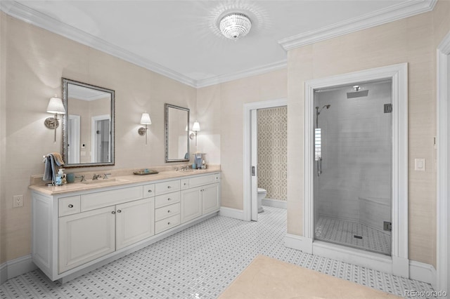 bathroom featuring ornamental molding, toilet, a shower with door, and vanity