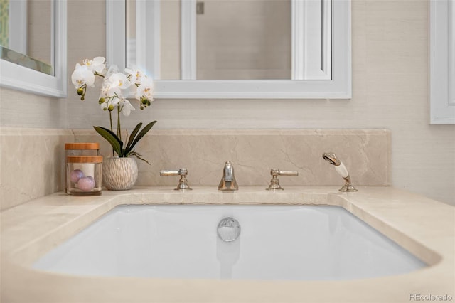 details with vanity and decorative backsplash