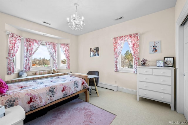 bedroom featuring light carpet, a baseboard heating unit, and an inviting chandelier