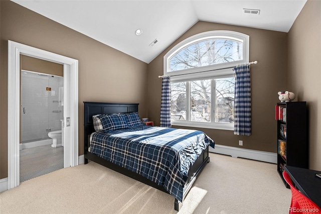 bedroom featuring baseboard heating, lofted ceiling, connected bathroom, and carpet floors