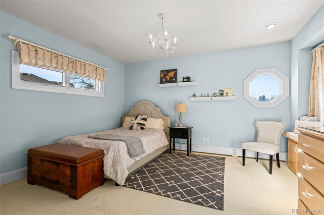 bedroom featuring carpet and a notable chandelier