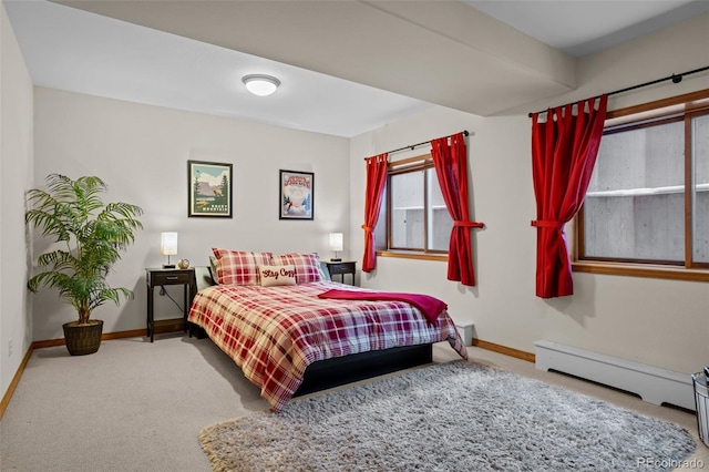 carpeted bedroom with a baseboard radiator