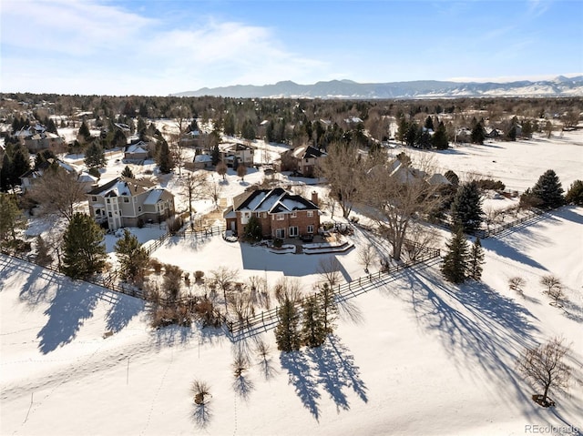 snowy aerial view with a mountain view