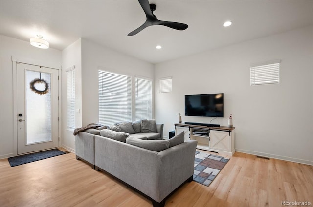 1929 W 165th Way, Broomfield, CO 80023 - living area with light wood-style floors, plenty of natural light, ceiling fan, baseboards, and recessed lighting