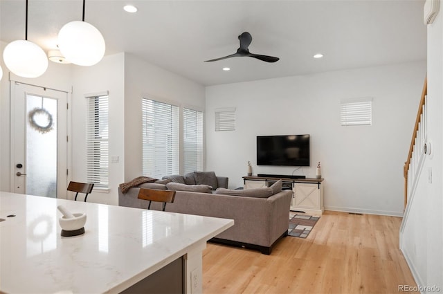 1929 W 165th Way, Broomfield, CO 80023 - living area with light wood-type flooring, a ceiling fan, recessed lighting, and baseboards