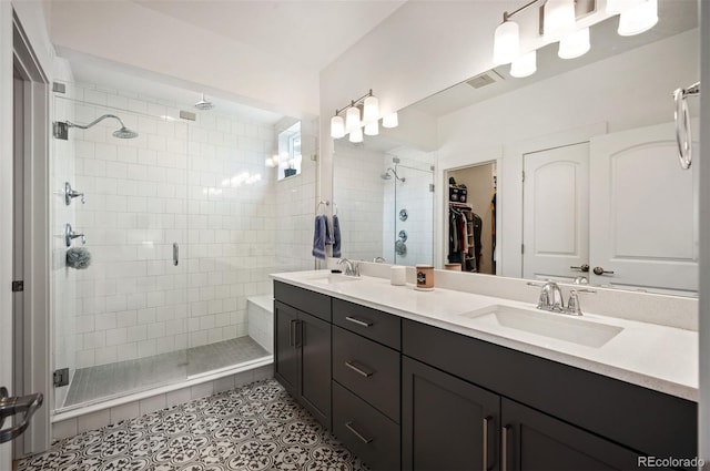 1929 W 165th Way, Broomfield, CO 80023 - bathroom with a stall shower, double vanity, tile patterned floors, and a spacious closet