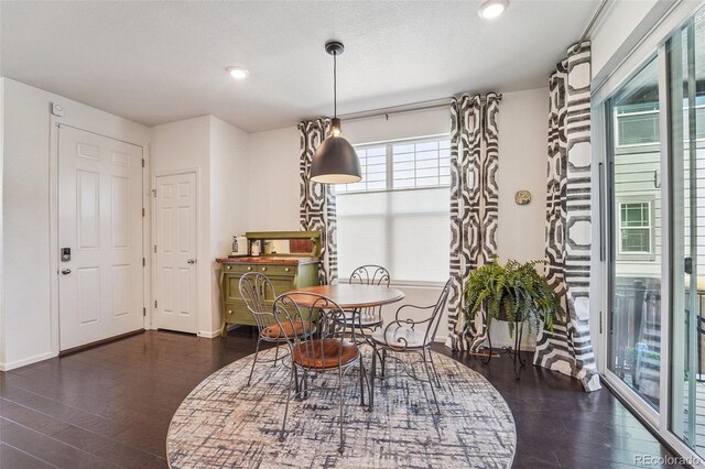 dining area with dark hardwood / wood-style floors