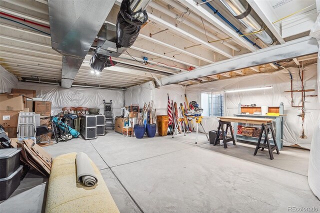 basement with a workshop area