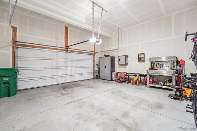 garage featuring a garage door opener and electric panel