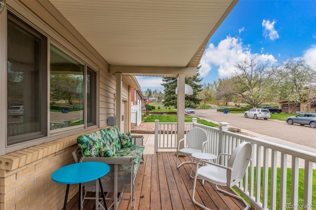 6905 Nelson St, Arvada, CO 80004 - wooden deck featuring a porch