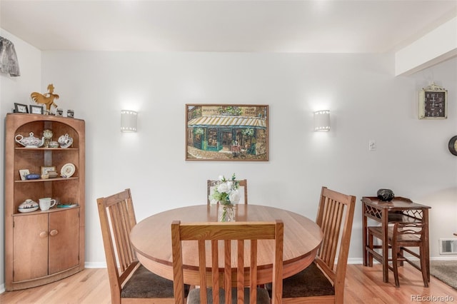 6905 Nelson St, Arvada, CO 80004 - dining room with light wood-style floors, baseboards, and visible vents