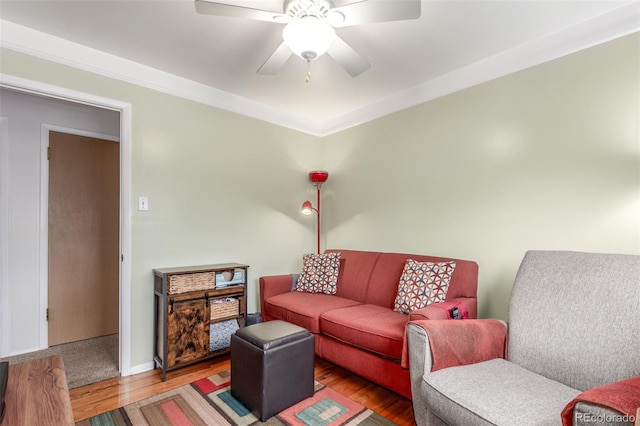 6905 Nelson St, Arvada, CO 80004 - living room with crown molding, a ceiling fan, and wood finished floors