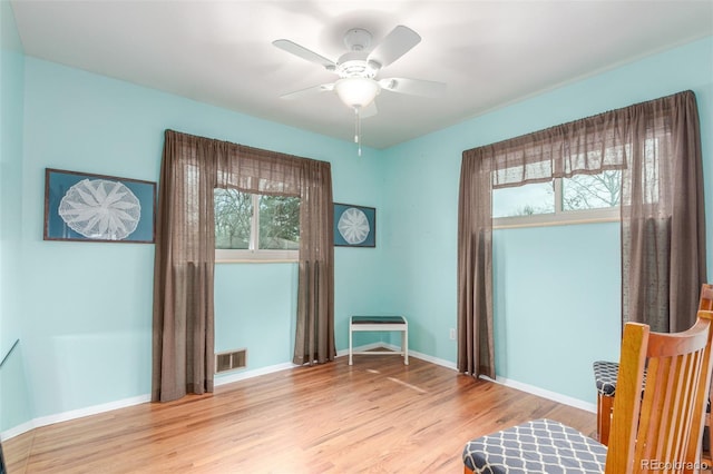 6905 Nelson St, Arvada, CO 80004 - sitting room with a ceiling fan, baseboards, visible vents, and light wood finished floors