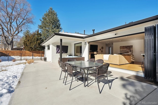 view of snow covered patio