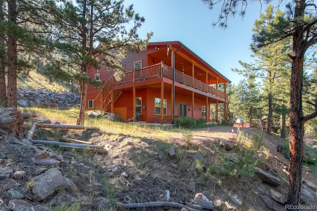 rear view of property with a deck