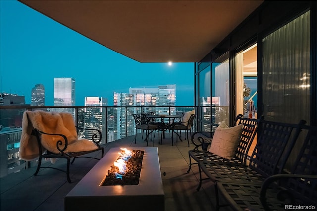 1133 14th St Unit 3420, Denver, CO 80202 - balcony at night with a fire pit and a view of city lights