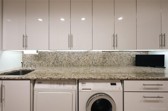 1133 14th St Unit 3420, Denver, CO 80202 - laundry area featuring cabinet space and washer and clothes dryer