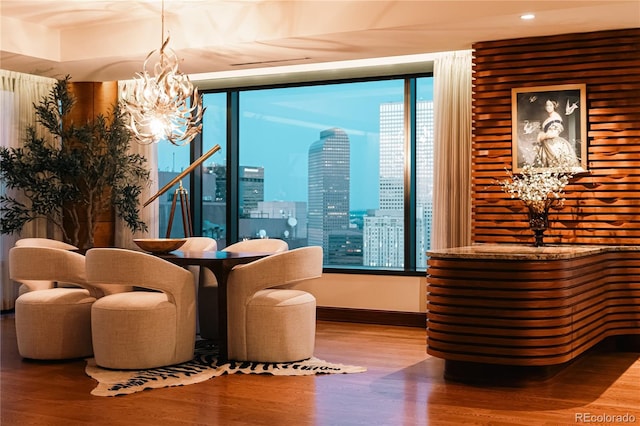 1133 14th St Unit 3420, Denver, CO 80202 - living area with wood finished floors, a chandelier, recessed lighting, and a skyline view