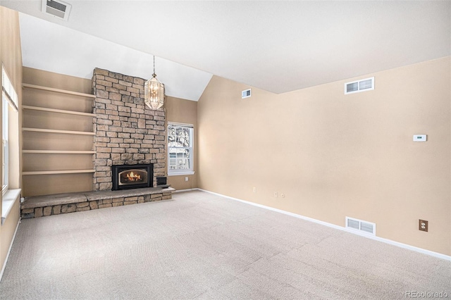 unfurnished living room with carpet floors, visible vents, and vaulted ceiling