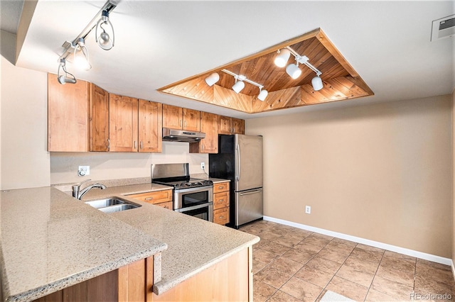 kitchen featuring stainless steel appliances, a raised ceiling, visible vents, a sink, and under cabinet range hood