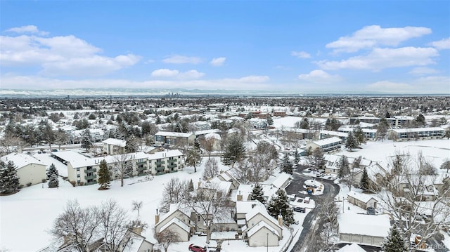 snowy aerial view with a residential view