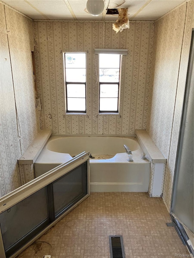 11469 Ruby Mountain Ln, Nathrop, CO 81236 - bathroom featuring a bath and wallpapered walls