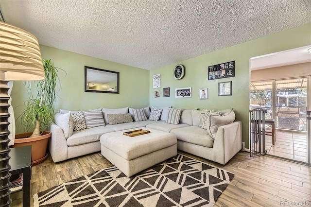 14742 E Radcliff Pl, Aurora, CO 80015 - living area featuring a textured ceiling and wood finished floors