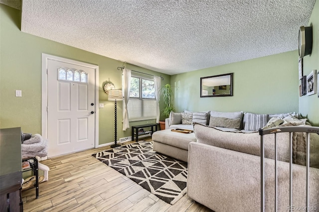 14742 E Radcliff Pl, Aurora, CO 80015 - living room featuring wood finished floors, a textured ceiling, and baseboards