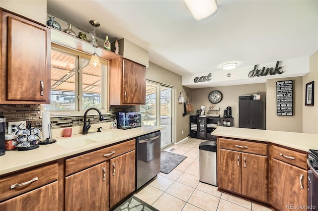 14742 E Radcliff Pl, Aurora, CO 80015 - kitchen with dishwasher, a sink, decorative backsplash, and light countertops