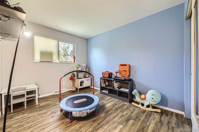 14742 E Radcliff Pl, Aurora, CO 80015 - playroom with wood finished floors and baseboards