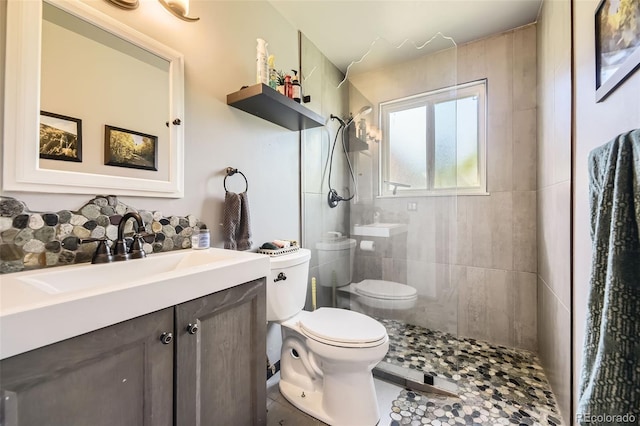 14742 E Radcliff Pl, Aurora, CO 80015 - full bathroom featuring toilet, a tile shower, vanity, and tile patterned flooring