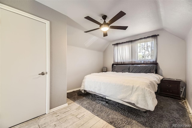 14742 E Radcliff Pl, Aurora, CO 80015 - bedroom featuring lofted ceiling, light wood-style floors, baseboards, and ceiling fan