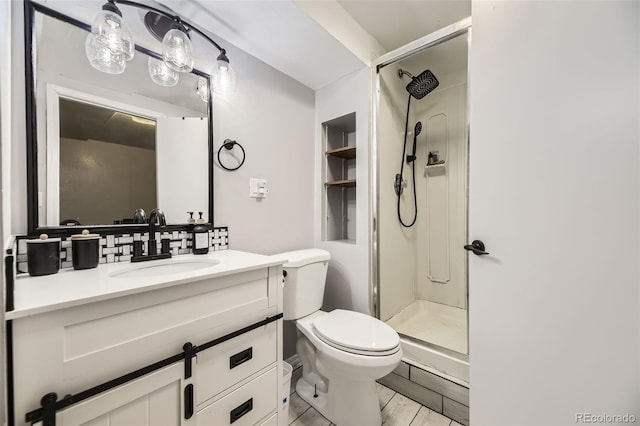 14742 E Radcliff Pl, Aurora, CO 80015 - bathroom with a stall shower, toilet, vanity, and tasteful backsplash