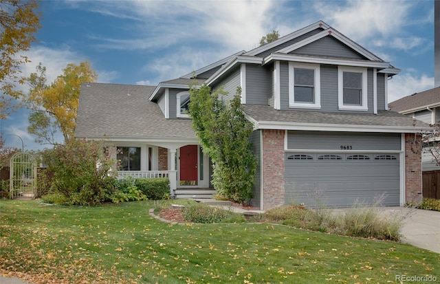 view of front of house featuring a front lawn and a garage