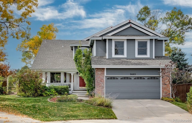 view of front of house with a front yard and a garage