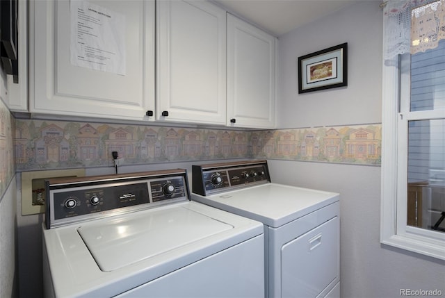 laundry room with cabinets and independent washer and dryer