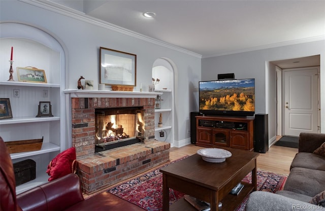 living room featuring ornamental molding and built in features