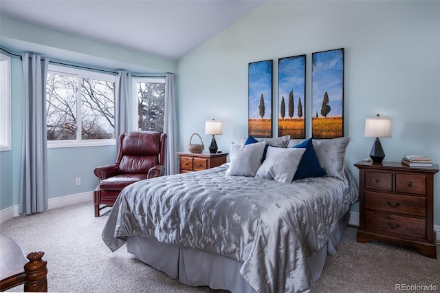 bedroom with vaulted ceiling and light carpet