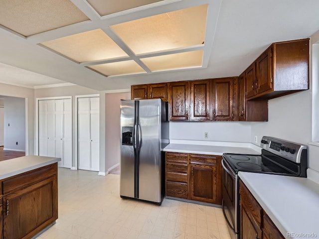 kitchen featuring appliances with stainless steel finishes, light countertops, and light floors