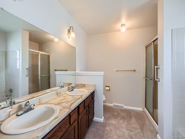 bathroom with a sink, visible vents, and a shower stall