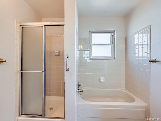 full bath featuring a bathing tub and an enclosed shower