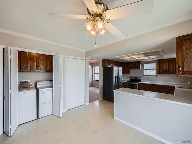 kitchen with washing machine and dryer, a sink, electric stove, fridge with ice dispenser, and light countertops