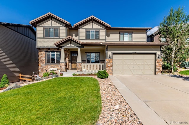 15647 Weaver Gulch Dr, Morrison, CO 80465 - craftsman inspired home with stone siding, covered porch, a garage, driveway, and a front yard